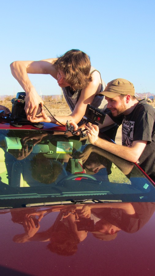 Crew strap the Red camera to the top of the red Corvette for El Jimador shoot in Anza Borrego desert